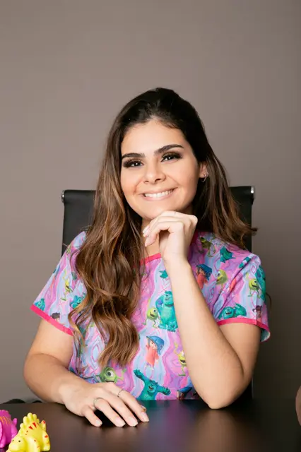 Retrato da Dra. Desirée Portelinha sorrindo.